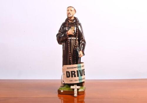 MONK: A hand painted plaster monk with cross. With September 2013 'GOODWOOD REVIVAL -DRIVER' competitor arm band