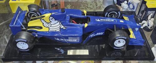MICHELIN: A rare large model of a Michelin branded F1 car, on presentation base with perspex case and inscription plaque reading 'Formula One World Championship 2003, Australian Grand Prix',car approx. 72cm long, 29cm wide