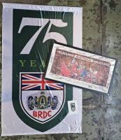 2003 FOSTER'S AUSTRALIAN GRAND PRIX/BRDC: A 2003 Foster's Australian Grand Prix picture. Mounting with numerous signatures from '75 YEAR BRDC Celebration' including Sir Jack Brabham, Tony Gaze, Sir Jackie Stewart, Win Percy & Tim Schenken. With large '75 