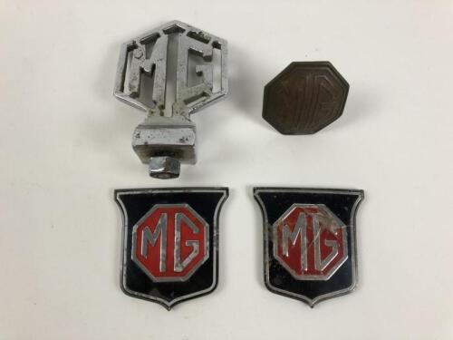 M.G: Four M.G car badges including a chrome double sided logo