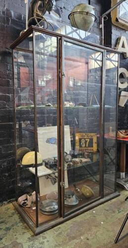 DISPLAY CASE: An antique upright brass and timber display case. Measures 182cm high, 120cm wide, 58cm deep