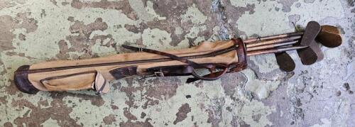 GOLF CLUBS: A vintage set of golf clubs with bag