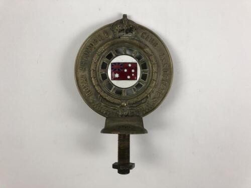 RACV: A Royal Automobile Club Associate (RACV) brass car badge. Membership number 26843