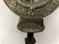 RACV: A Royal Automobile Club Associate (RACV) brass car badge. Membership number 26843 - 3