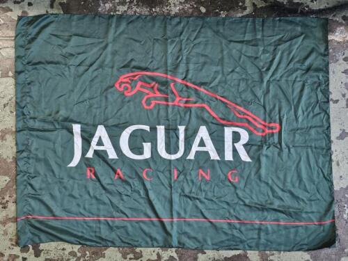 JAGUAR RACING: A 'JAGUAR RACING' cloth flag. Flag with dimensions of 130cm wide, 97cm high overall