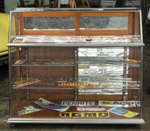 DISPLAY CASE: An attractive angled front display case. Measures 105cm high, 122cm wide, 55cm deep