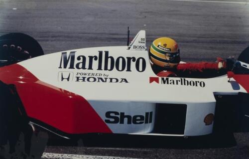 SENNA: Two reprinted colour pictures, after the original by Geoff Morrow, of Ayrton Senna racing a McLaren-Honda at the Australian Grand Prix, Adelaide