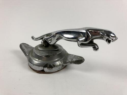 JAGUAR: A Jaguar 'Knock On' wheel hub cover with Jaguar Mascot