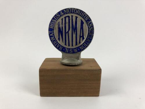 N.R.M.A: A National Roads & Motorists Association - N.S.W - badge on wooden plinth. Registered no: G 96.