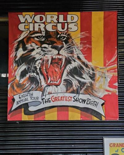 WORLD CIRCUS: A large canvas banner promoting 'WORLD CIRCUS - EIGHTH ANNUAL TOUR - THE GREATEST SHOW ON EARTH'. Painted by Bill Luke of Melbourne. Banner measures 2m&nbsp;square