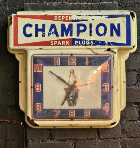 CHAMPION: A large CHAMPION SPARK PLUGS clock