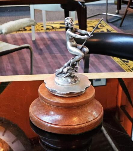 SORCERESS: A circa 1910 'La Sorciere' (Sorceress) mascot by Franz Bergman, Austria. Bronze mascot in the form of a female nude riding a broomstick above and owl with wings spread. Measures 13.5cm high