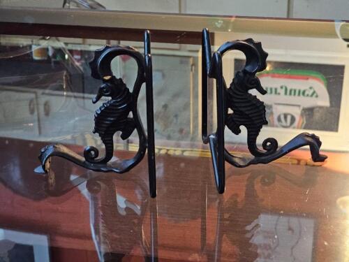 BOOK ENDS: A pair of cast iron Edwardian book ends in the form of a seahorse