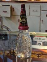 CASTROL: A embossed Castrol Wakefield one quart glass oil bottle with 'Super Grade' tin&nbsp;pourer