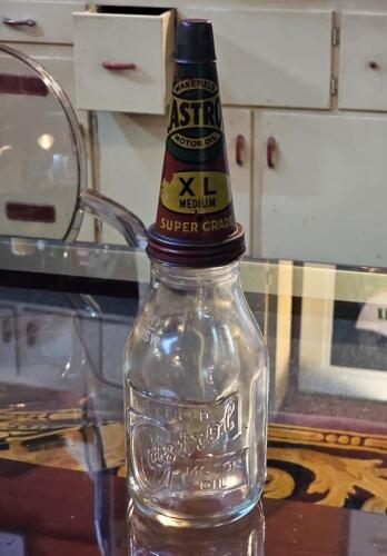 CASTROL: An embossed one quart Castrol Wakefield glass oil bottle with original tin 'XL Medium- Super Grade' pourer&nbsp;