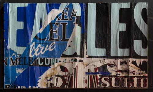 DECOLLAGE: A decollage of old billboard advertising material, by unknown Melbourne graffiti artist