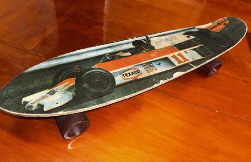 SKATE BOARD: A 1975/1976 skate board featuring an image of James Hunt racing a&nbsp;McLaren M23 Cosworth, 63cm long