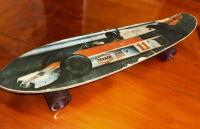 SKATE BOARD: A 1975/1976 skate board featuring an image of James Hunt racing a&nbsp;McLaren M23 Cosworth, 63cm long