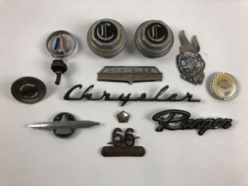 CHRYSLER: A group of Chrysler car badges and associated items