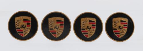 911: A set of PORSCHE wheel centre caps, emblazoned with PORSCHE emblem