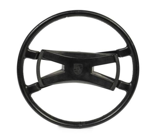911 STEERING WHEEL: A circa 1970s Porsche 901/911/912 steering wheel with butterfly horn push button