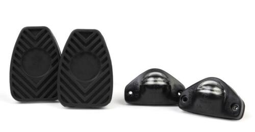 911 SPARE PARTS: A group of new old stock Porsche 911 spare parts including two pedal pads (914 423 210 00) and two license plate lights (911 631 620 04/409)'