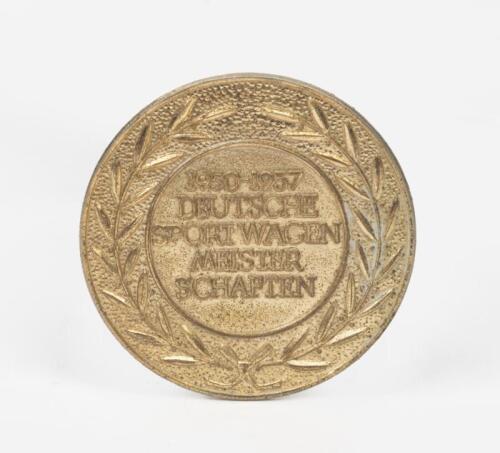 PORSCHE: A brass badge with inscription '1950-1957 DEUTSCHE SPORTWAGEN MEISTERSCHAFTEN