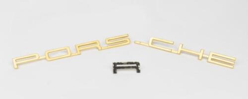 356: A reproduction 'PORSCHE' 356 logo badge in gold