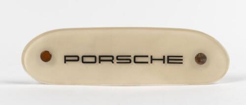 PORSCHE: A 'PORSCHE' plastic placard with mounting screws
