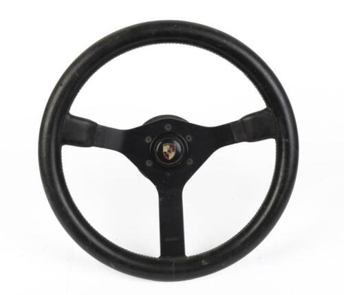 MOMO: A aftermarket Momo steering wheel with Porsche centre horn button