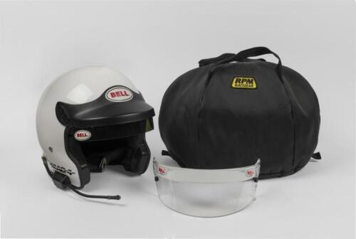 RACING HELMET: A white BELL MAG 4 racing helmet with radio speaker and visor