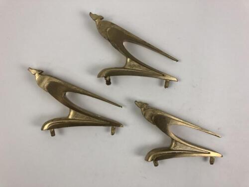 KANGAROO: Three stylised gold kangaroo bonnet mascots