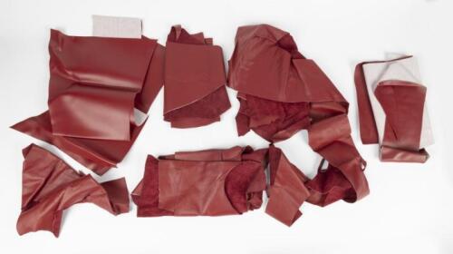 LEATHER: A bag of red leather and vinyl offcuts.