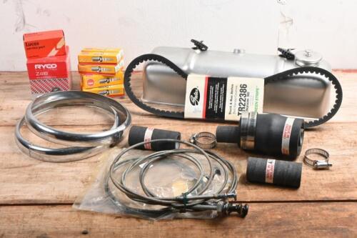 MG: A collection of MG T-Series service parts including spark plugs, belts, oil filter, rubber hoses, contact set, headlight rims, choke cables. Together with rocker cover