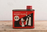 BRAKE FLUID: A 1960's unused, unopened tin can of hydraulic brake fluid by La Marque Mondiale