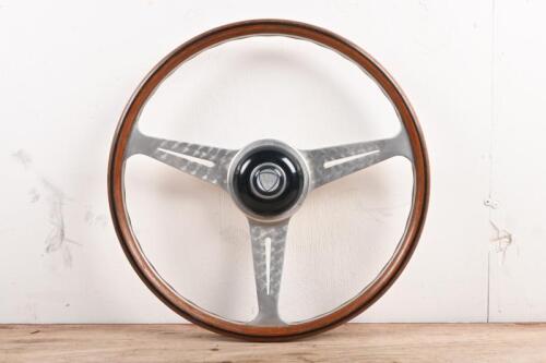 NARDI: A wood rimmed Nardi steering wheel with added Lancia centre horn button 'made in Italy 66' stamped to rear. 40cm diameter.