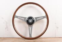 NARDI: A wood rimmed Nardi steering wheel with added Lancia centre horn button 'made in Italy 66' stamped to rear. 40cm diameter.