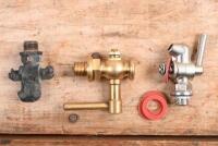 RADIATOR TAPS AND WASHERS: Two new old stock and one used radiator drain taps and washers