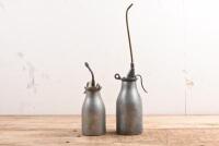 OIL BOTTLES: Two 1920's -1950's aluminium alloy 'Reilang' oil bottles of different sizes