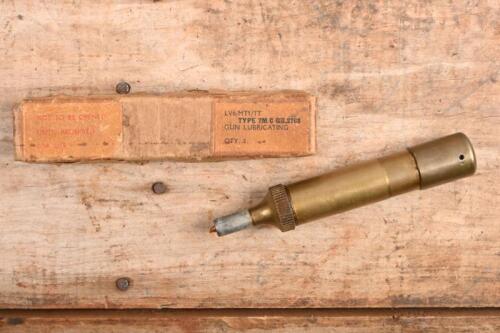 LUBRICATING GUN: A circa 1950s brass lubricating gun