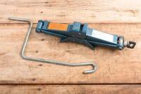 WHEEL JACK: A Ford wheel jack and handle