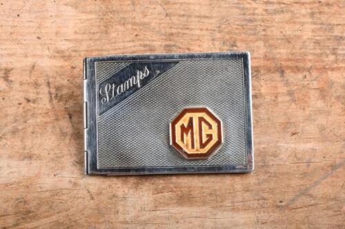MG: A circa 1930s - 1950s silver 'MG Stamps' holder