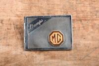 MG: A circa 1930s - 1950s silver 'MG Stamps' holder