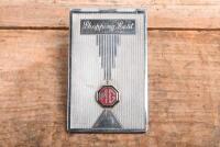 MG: A circa 1930s - 1950s silver 'MG Shopping List' holder