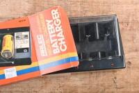 TOOL BOX: A metal tool box with a unused MICRONTA MULTITESTER & mint and boxed ARLEC UNIVERSAL BATTERY CHARGER - 3