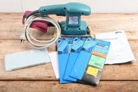 SANDER: A Makita MODEL BO3700 Finishing Sander. Additional orbital sanding sheets