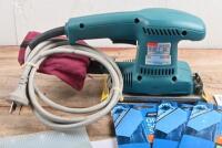 SANDER: A Makita MODEL BO3700 Finishing Sander. Additional orbital sanding sheets - 2