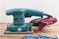 SANDER: A Makita MODEL BO3700 Finishing Sander. Additional orbital sanding sheets - 3