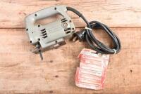 JIG SAW: A Black & Decker F.A. 10881 jig saw. With spare blades