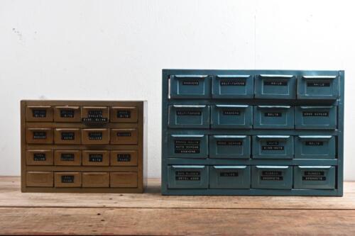 METAL STORAGE UNITS: Two metal storage boxes. Some compartments stocked with drill bits, nuts, bolts and washes, grommets, clips